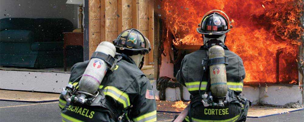 fire fighters in front of fire